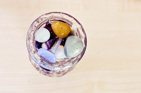 Colorful semiprecious stones in a glass vase. closeupの写真素材