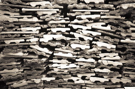 Background texture of old gray concrete fence with square pattern and concrete plates