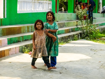 Rural smiling girls sisters closeup morning in sunlight Amroha, Uttar pradesh, Indiaのeditorial素材
