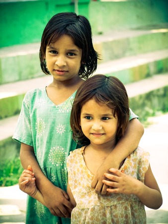 Rural smiling girls sisters closeup morning in sunlight Amroha, Uttar pradesh, Indiaのeditorial素材