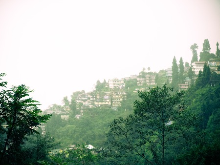 View of Darjeeling town in fog, India