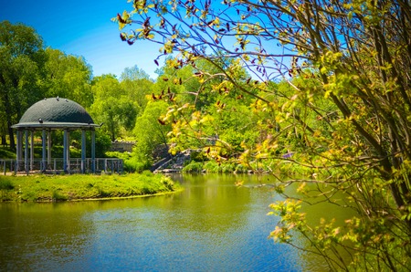Gazebo or alcove on shore of lake in Feofaniya, Kyiv Ukraineの写真素材