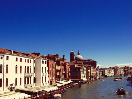 Amazing view on the beautiful Venice, Italy. Many gondolas sailing down one of the canals.の写真素材