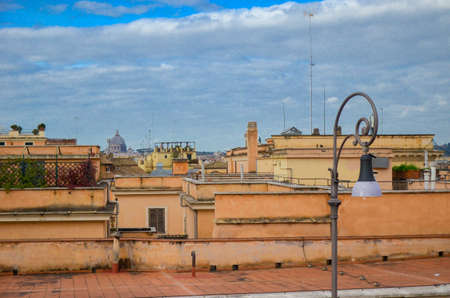 View to the roofs of Rome, Italy with street lightの写真素材