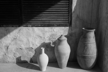 earthenware old jugs closeup photoの写真素材