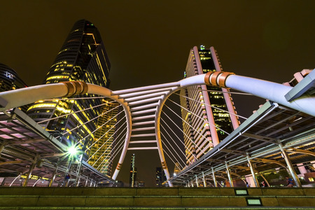 Chong Nonsi Bangkok Sky Train Station's Skywalk Bridge with the modern buildings on background.