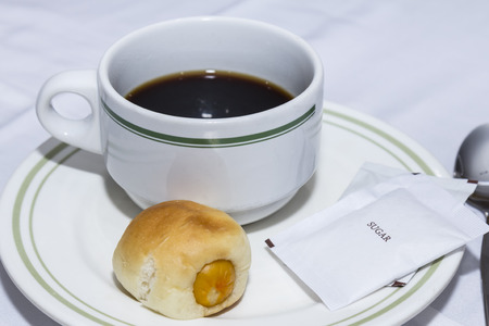 Coffee cup and bun  for breaking times to meet.の写真素材