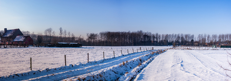 a snow landscape on a sunny day in Belgiumの写真素材