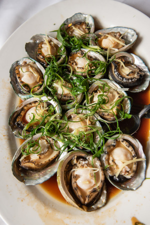 Steamed abalone dish at a chinese restaurant a very popular dish at asian wedding reception ceremoniesの写真素材