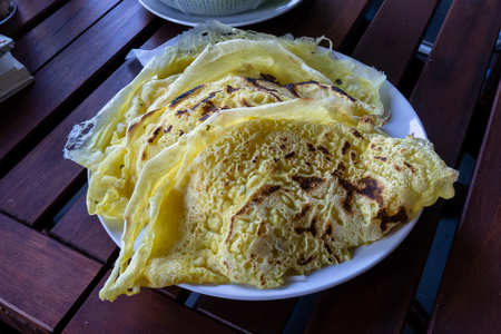 Homemade crispy savory vietnamese yellow pancakesの写真素材