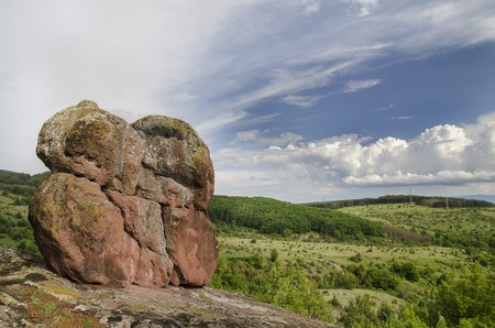 Landscape with clouds, rock and blue skyの写真素材