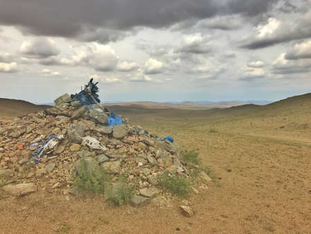 Ovoo, oboo, or obo - sacred stone heaps used as altars or shrines in Mongolia. Found in the steppe outside of Ulaanbaatarの写真素材