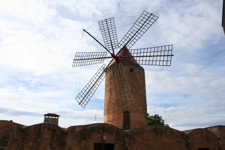 Old windmill against blue skyの写真素材