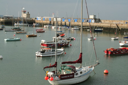 Colorful sailboats sitting in water at portのeditorial素材