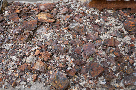 Fragments of old  pipes ,metal pipe destroyed. Rusty steel tube with holes metal