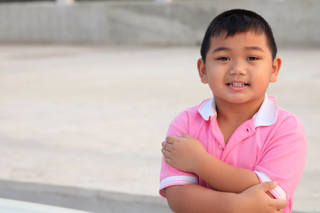Kid portrait smiling and cross one's arm  - Asia childrenの写真素材