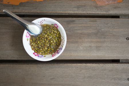 Boiled mung bean with sugar on wood table, Thai dessertの写真素材