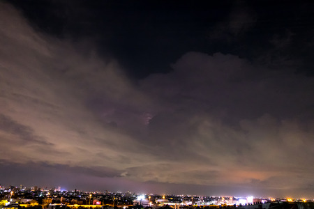 night sky with lightning and storm in city,Bangkok,Thailand.(Selective focus)