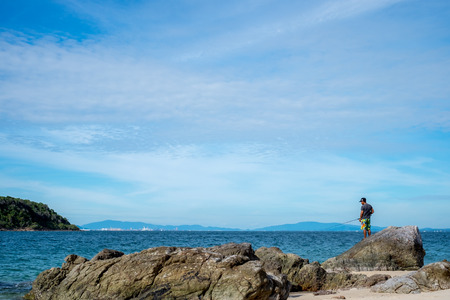 sea scape and fishing man in Pattaya beach,Thailand.の写真素材