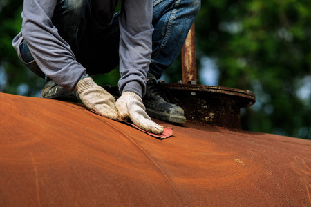 Surface preparation with sand paperの写真素材