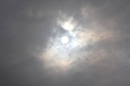 The sun seen through thick clouds