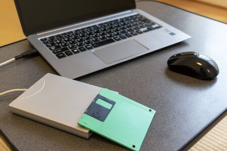 PC and floppy diskの写真素材