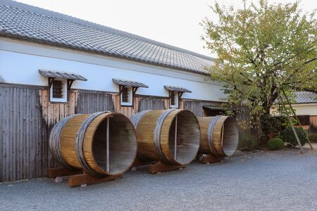 Large wooden tubs of sake brewery