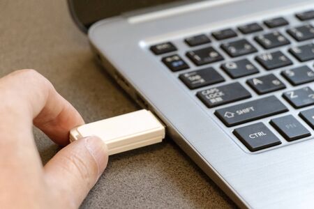 Insert USB stick into a computer