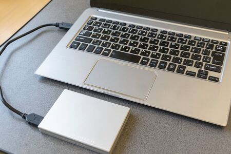 Portable hard disk connected to a laptop