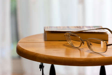 A book and a melee on the desk.の写真素材