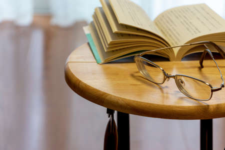 A book and a melee on the desk.の写真素材