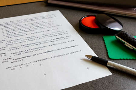 Signatures and thumbprints on contractsの写真素材
