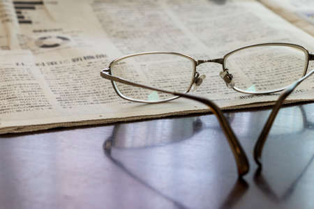 Glasses and newspaperの写真素材