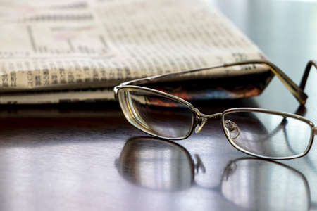 Glasses and newspaper