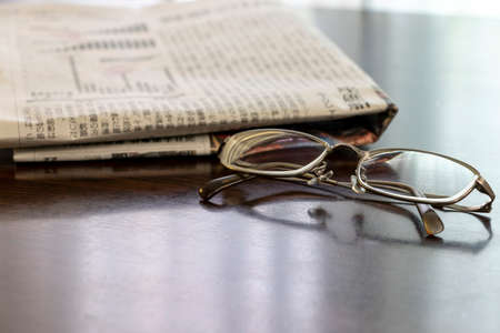 Glasses and newspaperの写真素材