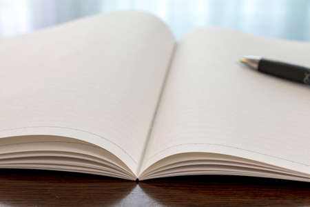 Notebook and pen on the table