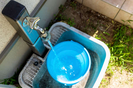 Collect water in a bucketの写真素材