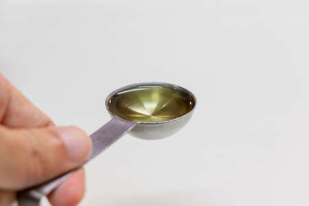 Measuring spoon and cooking oilの写真素材