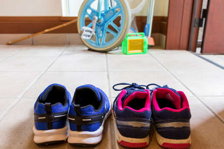Children's shoes and playthings at the entrance