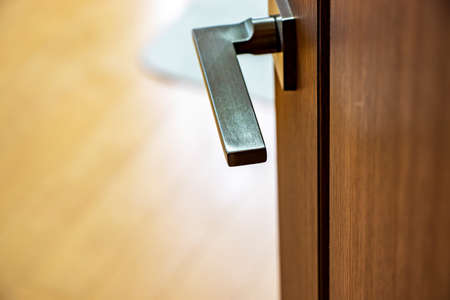 Metal knob mounted wooden doorの写真素材