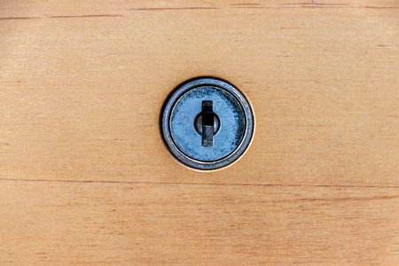 Wooden drawer and metal keyholeの写真素材