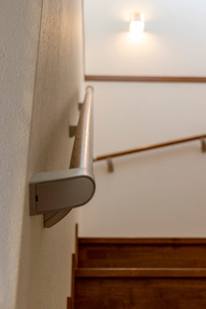 Wooden railing mounted on the wall in the houseの写真素材
