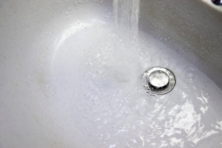 Water splashing in the sinkの写真素材