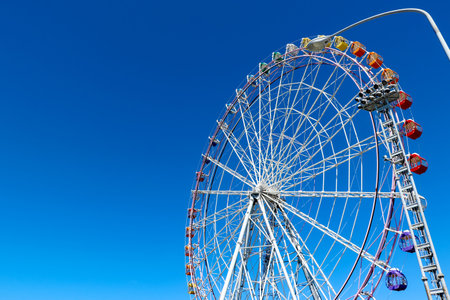 Ferris wheel and clear blue skyの写真素材