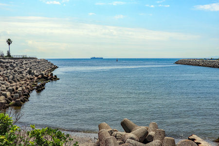 Sea cove surrounded by wave-dissipating blocksの写真素材