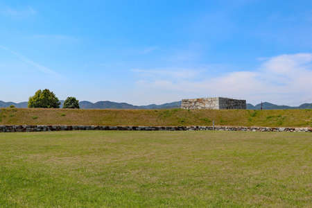 Stone wall left in the field at Japanese castle ruins
