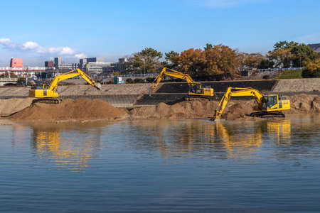 Dredging work using hydraulic excavators at Muko River, Hyogo