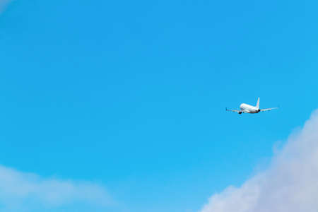 An airplane taking off toward the blue skyの写真素材