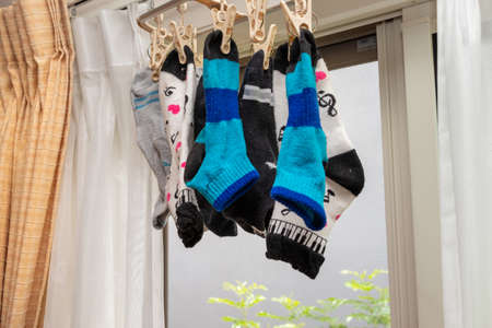 Socks hanging by the window