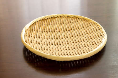 Round colander made of bambooの写真素材